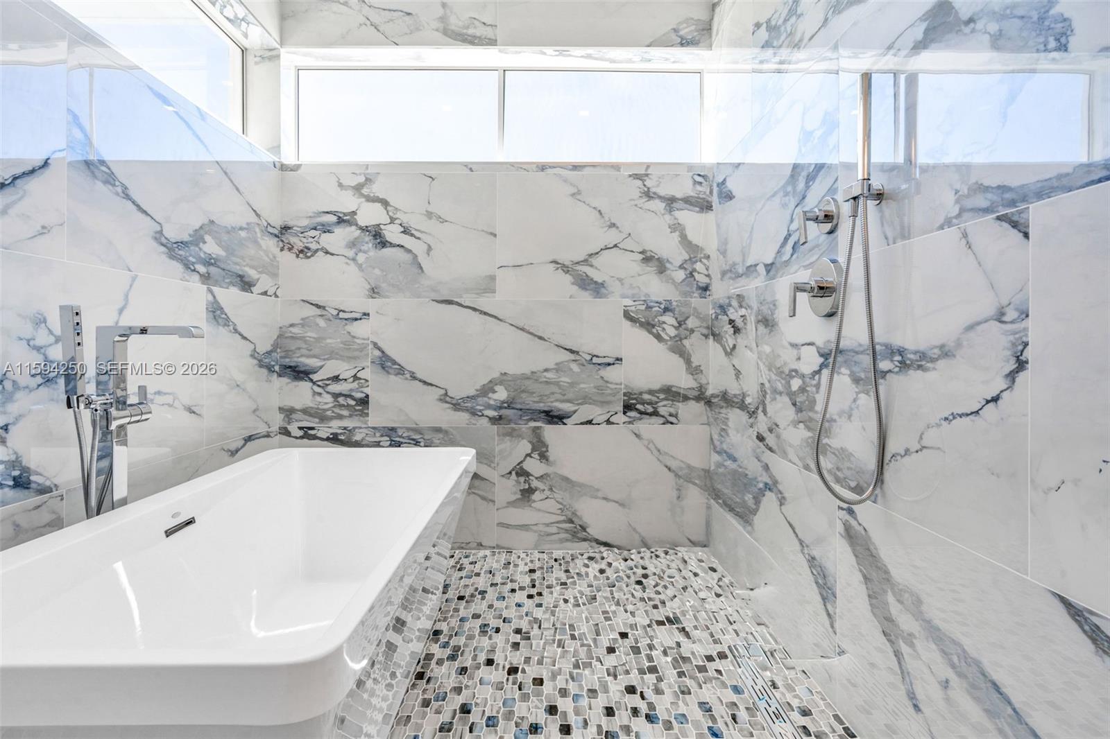 84 Coral Way Key Largo, FL 33037 - Photo 37 of 55 a bathroom with a bathtub