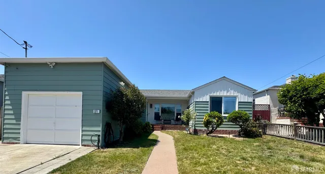 a view of house with yard outdoor seating and entertaining space