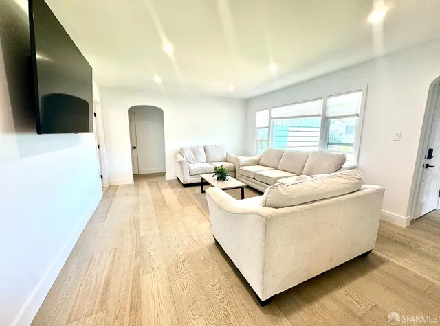 a living room with a couch and a flat screen tv