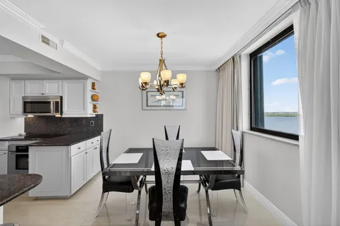 a kitchen with granite countertop a stove and a microwave