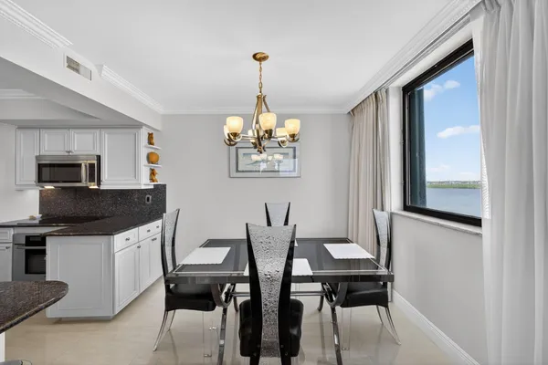 a kitchen with granite countertop a stove and a microwave