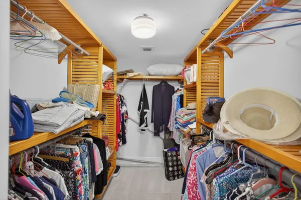 a bathroom with a shower a toilet and sink