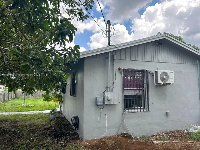 a house with trees in front of it