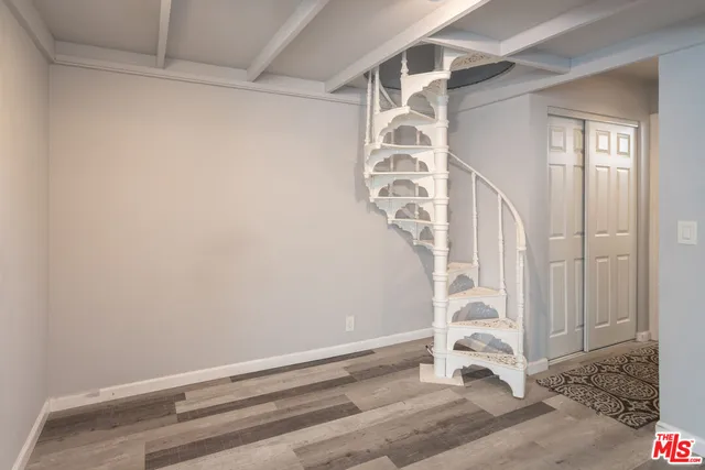 a view of entryway with wooden floor