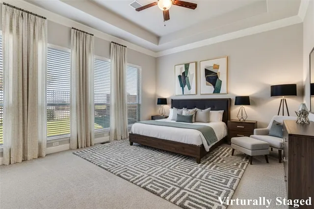 a spacious bedroom with two beds and a chandelier