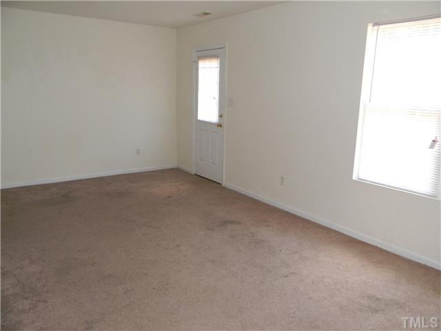 1315 East Lane Street, Unit 2 Raleigh, NC 27610 - Photo 3 of 11 an empty room with windows
