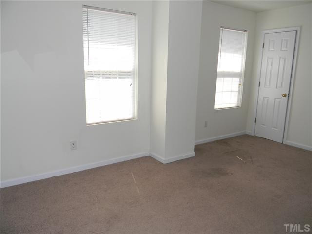 1315 East Lane Street, Unit 2 Raleigh, NC 27610 - Photo 6 of 11 an empty room with a window