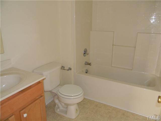 1315 East Lane Street, Unit 2 Raleigh, NC 27610 - Photo 10 of 11 a bathroom with a toilet and a bathtub