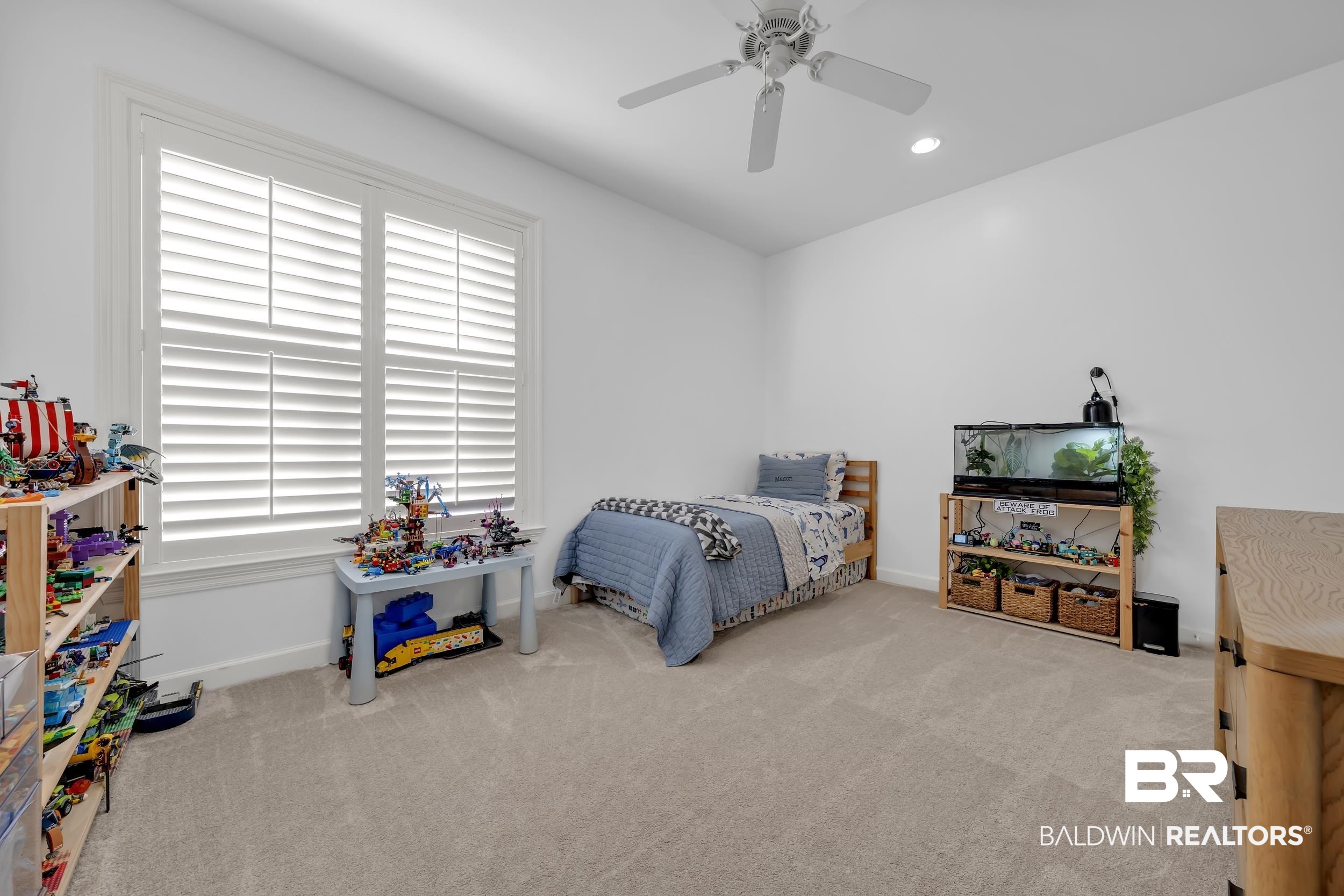 8137 Pine Run Daphne, AL 36527 - Photo 33 of 67 Carpeted room featuring a large window with white plantation shutters, a ceiling fan, and recessed lighting