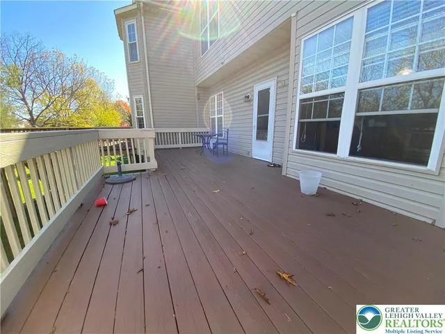 a view of a balcony with wooden floor