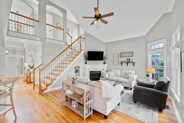 a living room with fireplace furniture and a flat screen tv