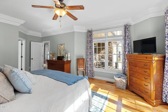 a bathroom with a tub a sink and glass door