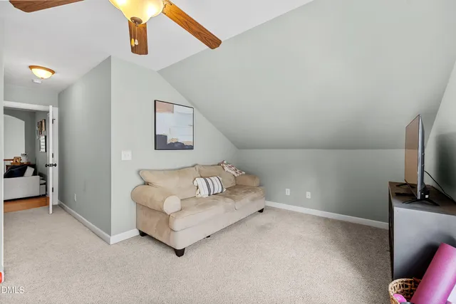 a balcony with furniture and a potted plant