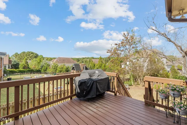 a view of house with backyard and outdoor seating