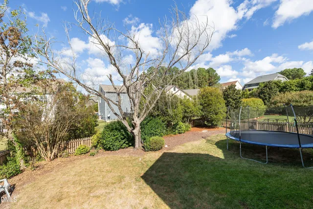 an aerial view of a house with swimming pool and outdoor space