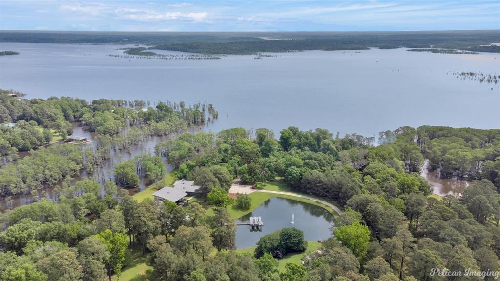 Over 6 acres behind private gate with 550 feet of seawall on Lake Bistineau