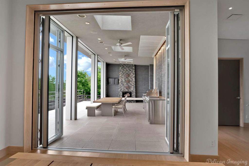 613 Moore Road Elm Grove, LA 71051 - Photo 15 of 39 NanaWall Doors from the den to the covered patio and outdoor kitchen