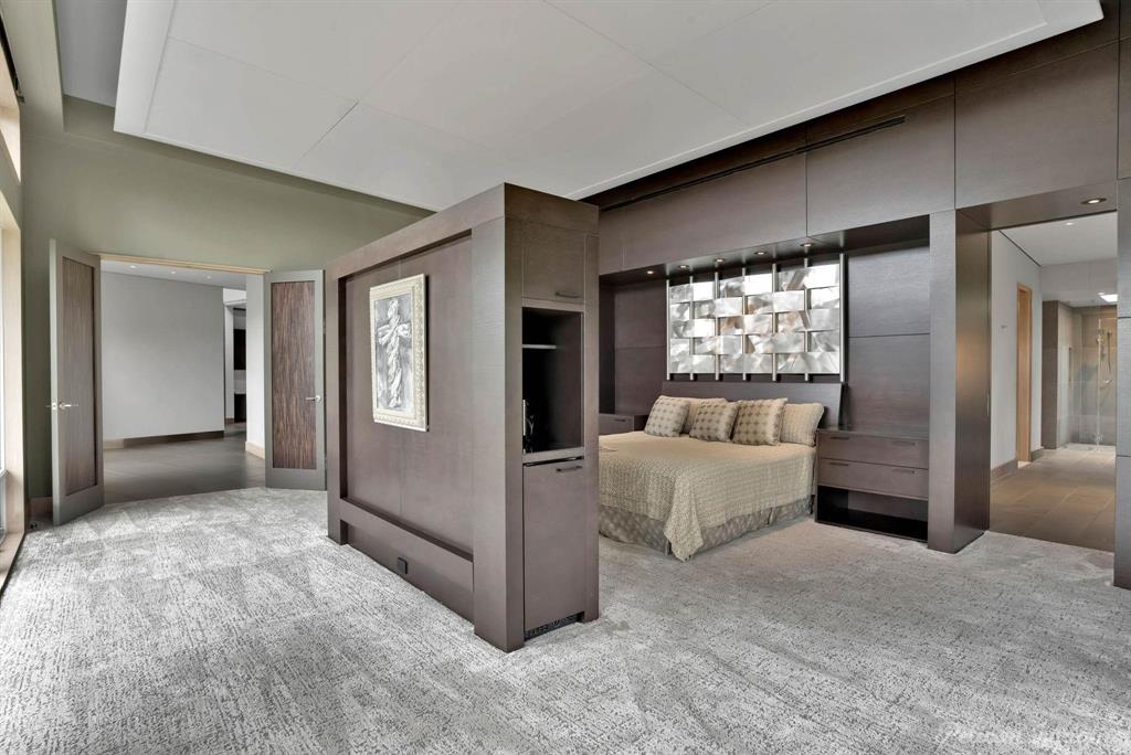 613 Moore Road Elm Grove, LA 71051 - Photo 18 of 39 Large primary suite with two bathrooms, a large closet, and a laundry room. Offering gorgeous private views and windows and doors allowing you to enjoy the fresh breeze