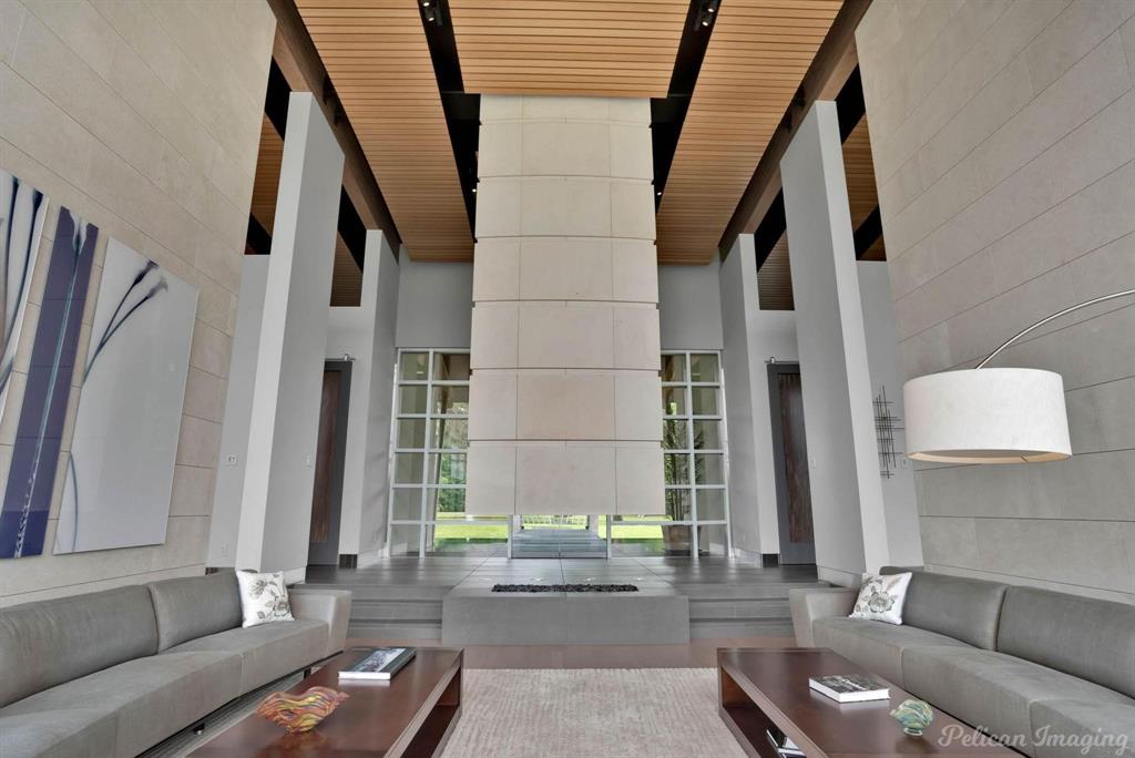 613 Moore Road Elm Grove, LA 71051 - Photo 8 of 39 Living room with bamboo floors and beautiful natural light and custom hanging fireplace made with limestone from Portugal