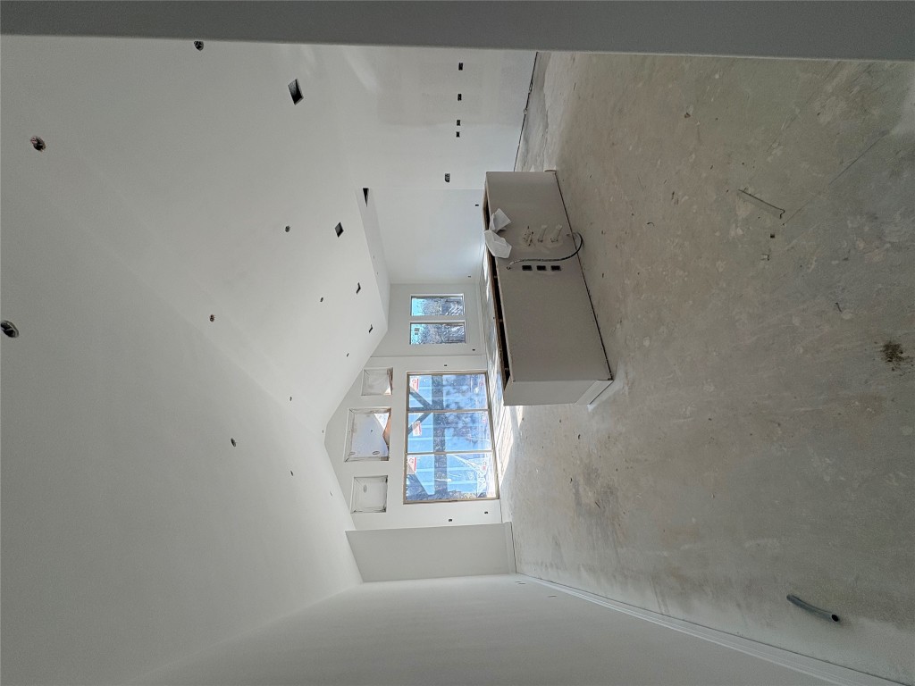 1912 Scenic Hts Lane Georgetown, TX 78628 - Photo 4 of 10 Unfurnished living room with vaulted ceiling