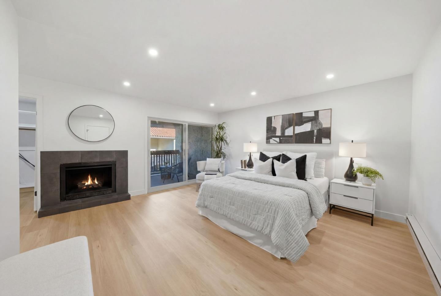 409 Puerto Place Hayward, CA 94541 - Photo 27 of 54 a spacious bedroom with a bed and a fireplace