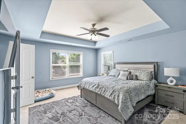 a bedroom with a bed and window