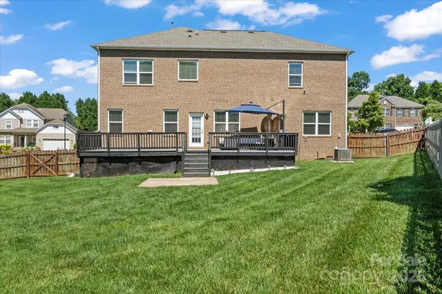 a front view of house with yard and outdoor seating