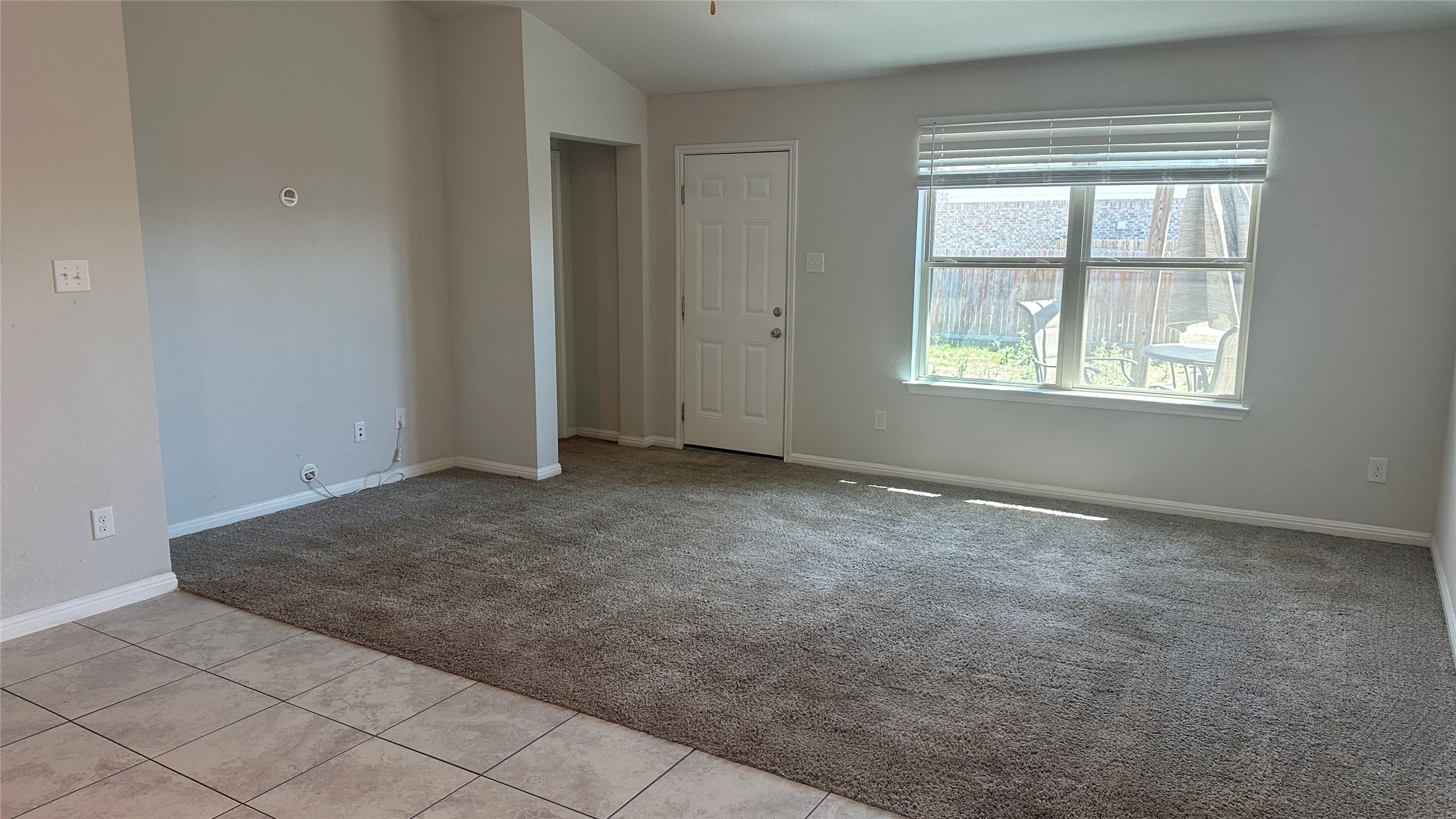 12321 Caldera Way Manor, TX 78653 - Photo 7 of 18 Spare room with light carpet and light tile patterned flooring