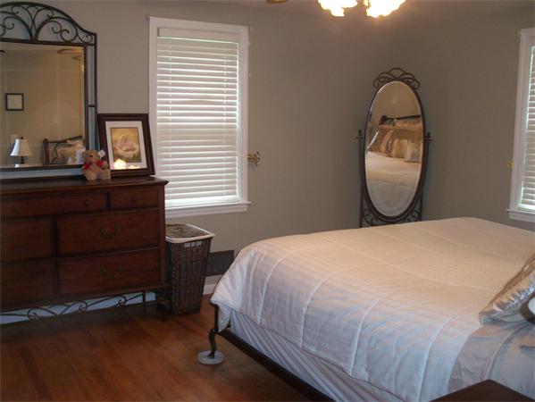 3 Allen Road Peabody, MA 01960 - Photo 8 of 15 a bedroom with a bed and a mirror on dresser
