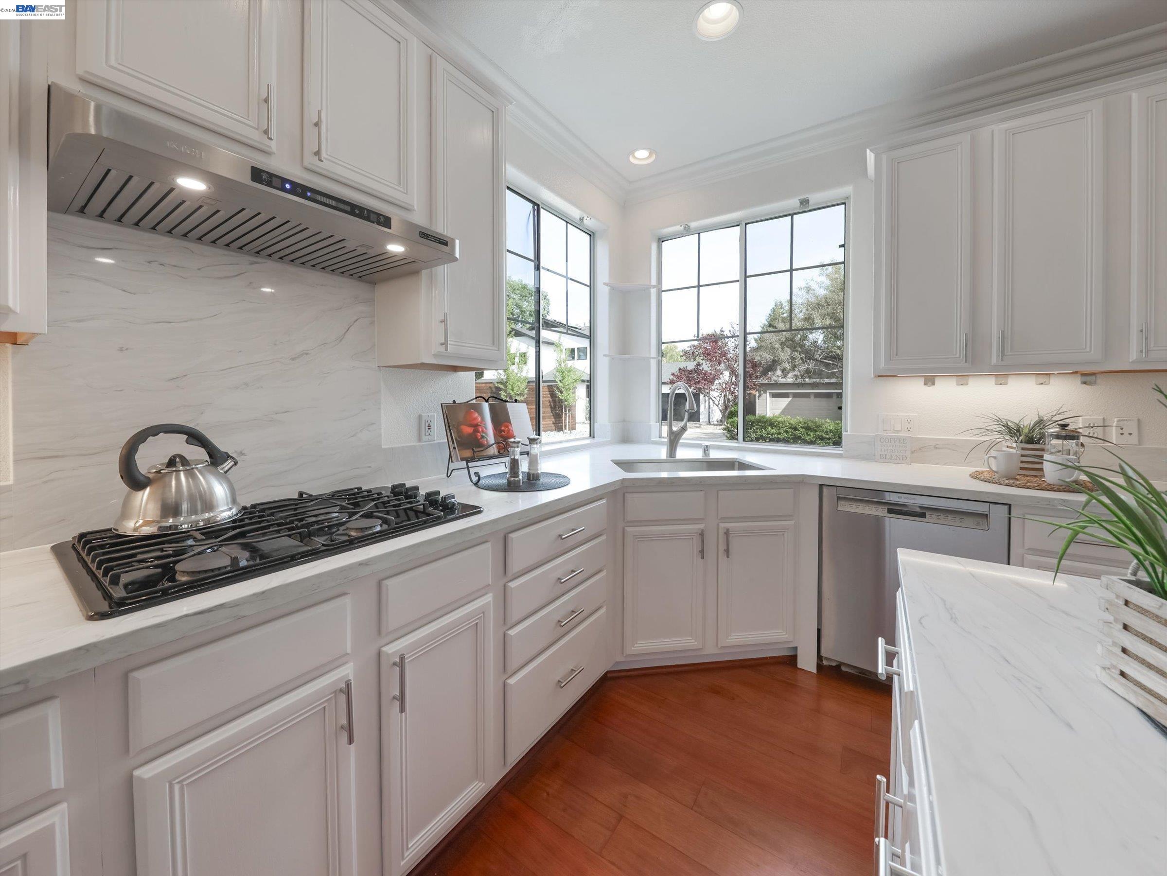 326 I Street Fremont, CA 94536 - Photo 16 of 40 a kitchen with white cabinets and appliances