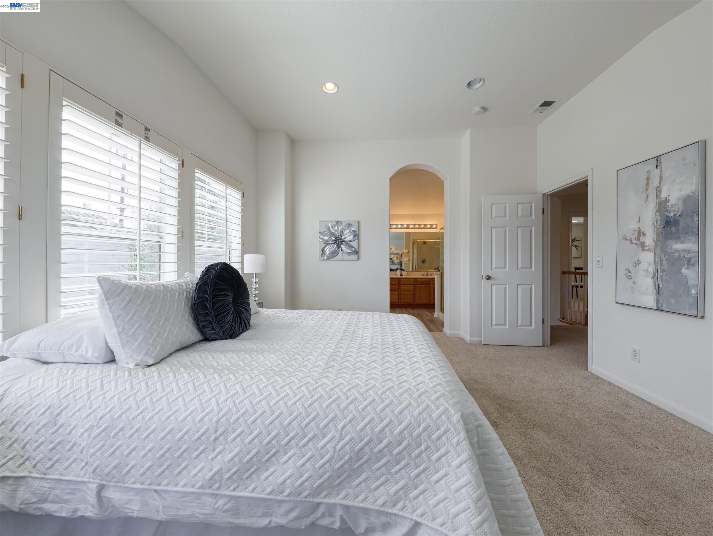 326 I Street Fremont, CA 94536 - Photo 18 of 40 a spacious bedroom with a bed and a large window