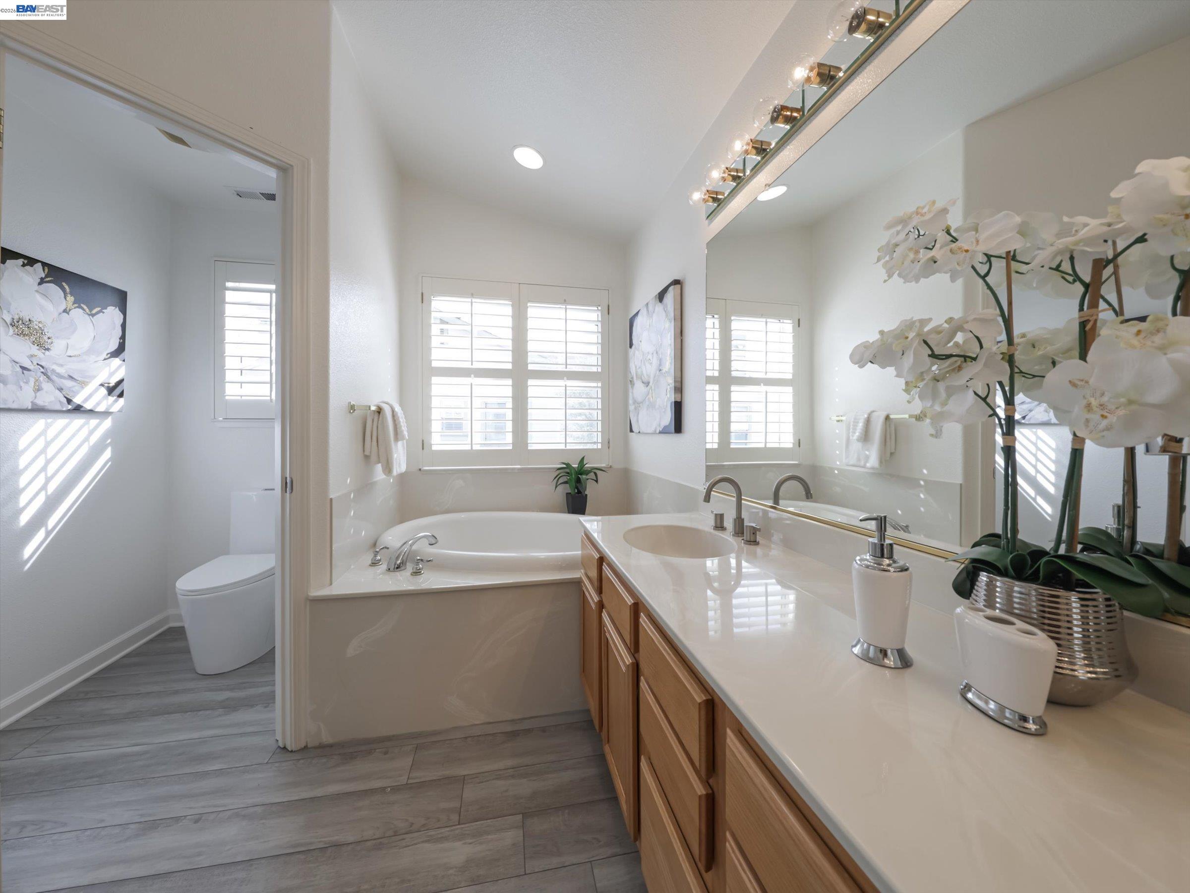 326 I Street Fremont, CA 94536 - Photo 20 of 40 a spacious bathroom with a double vanity sink a mirror and a bathtub