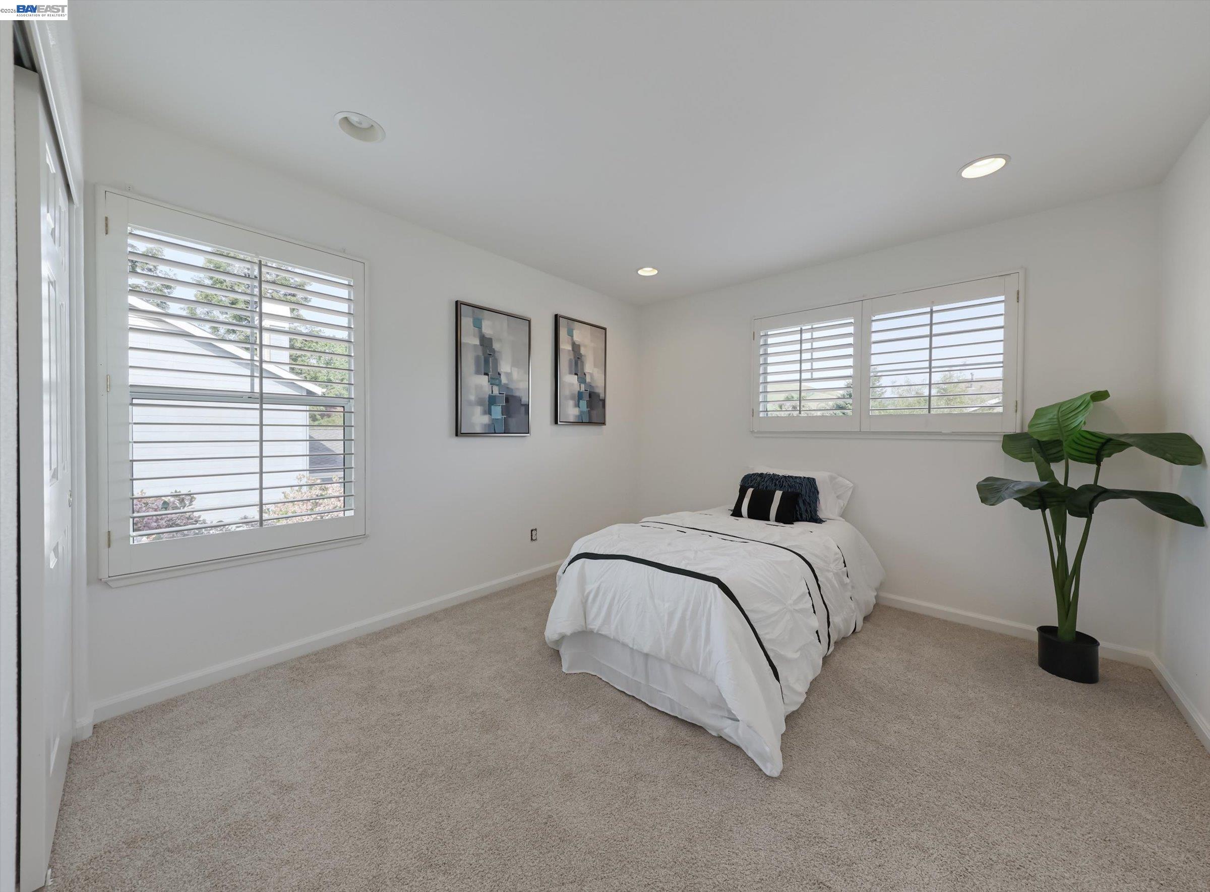 326 I Street Fremont, CA 94536 - Photo 24 of 40 a bed sitting in a bedroom next to a window