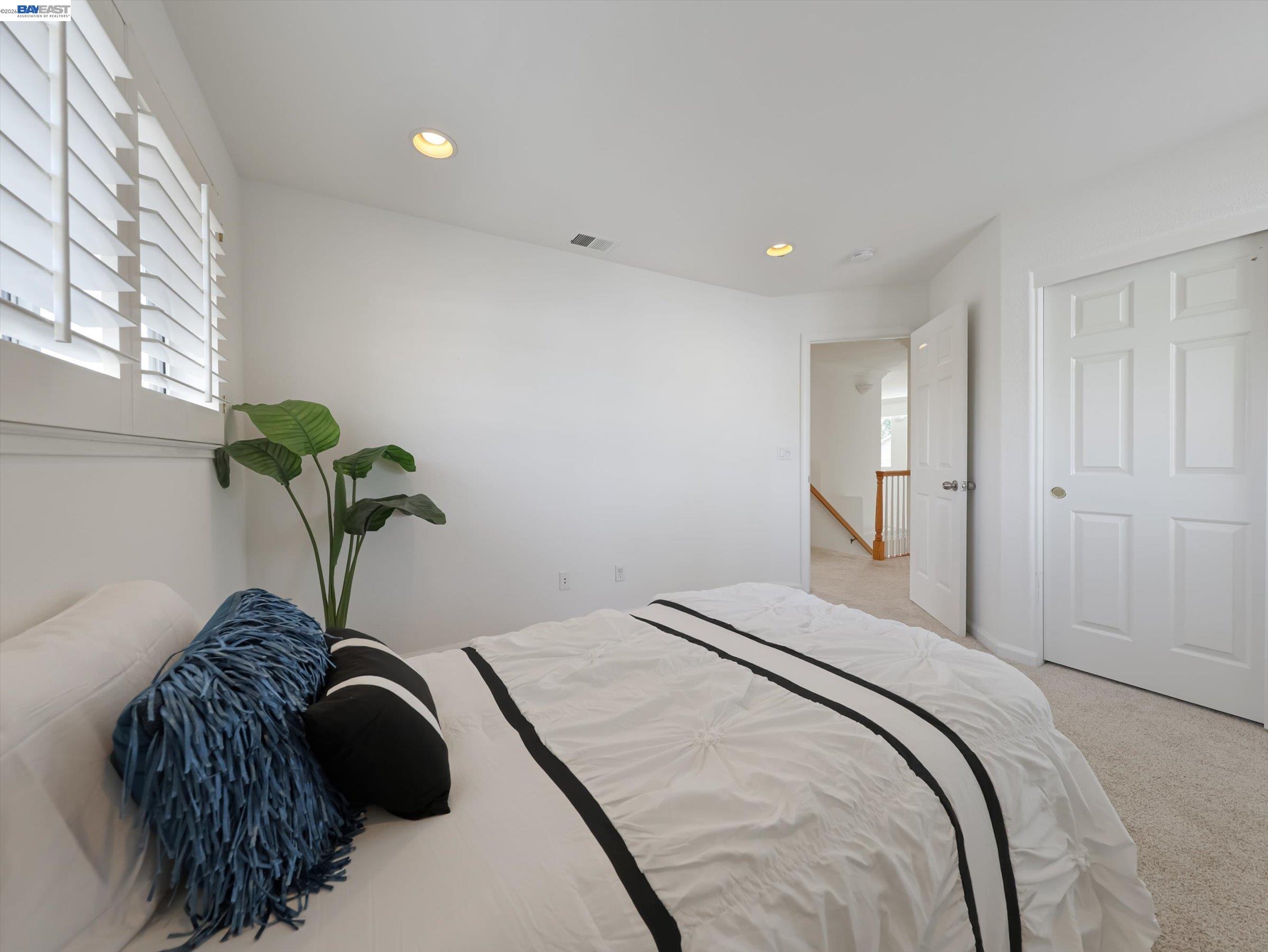 326 I Street Fremont, CA 94536 - Photo 25 of 40 a bedroom with a bed and a potted plant