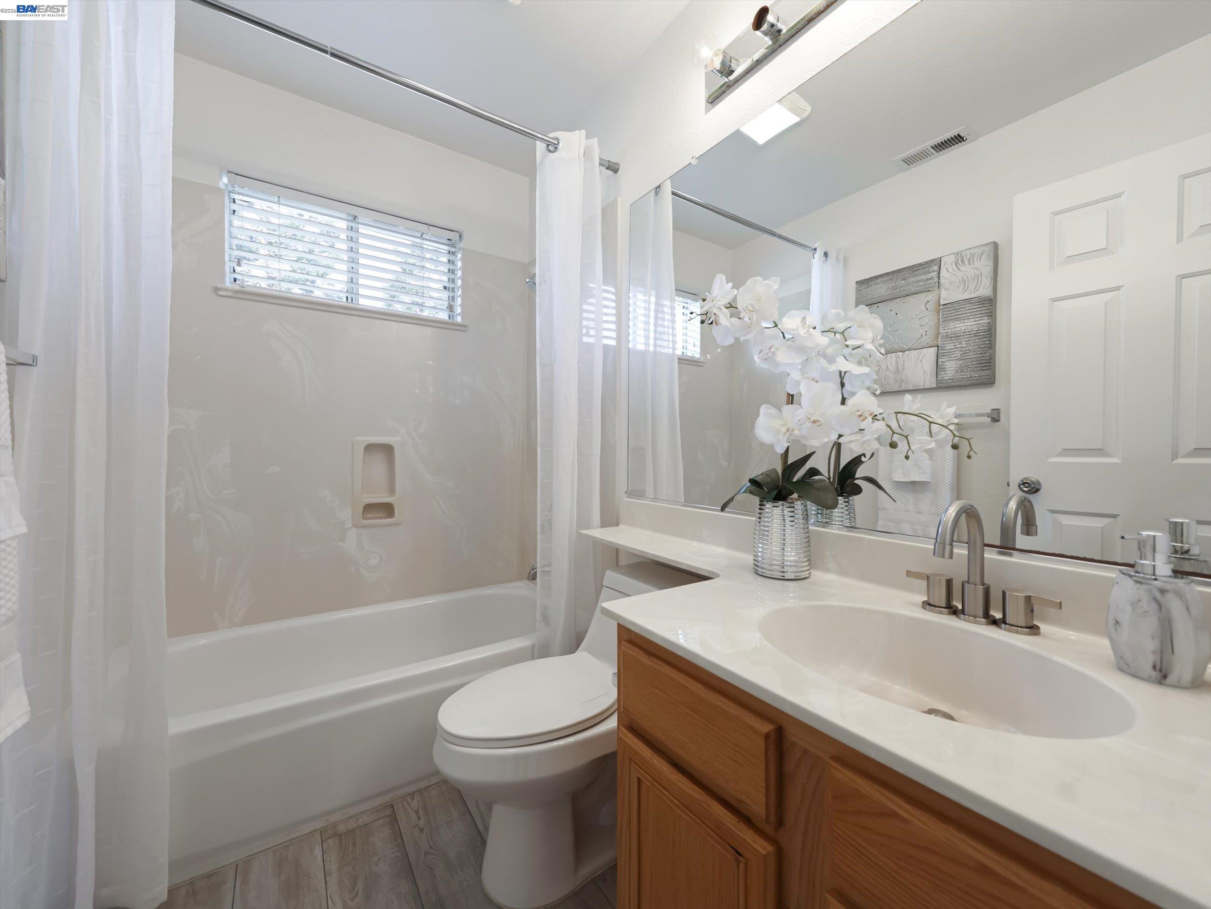 326 I Street Fremont, CA 94536 - Photo 28 of 40 a bathroom with a sink a toilet and shower