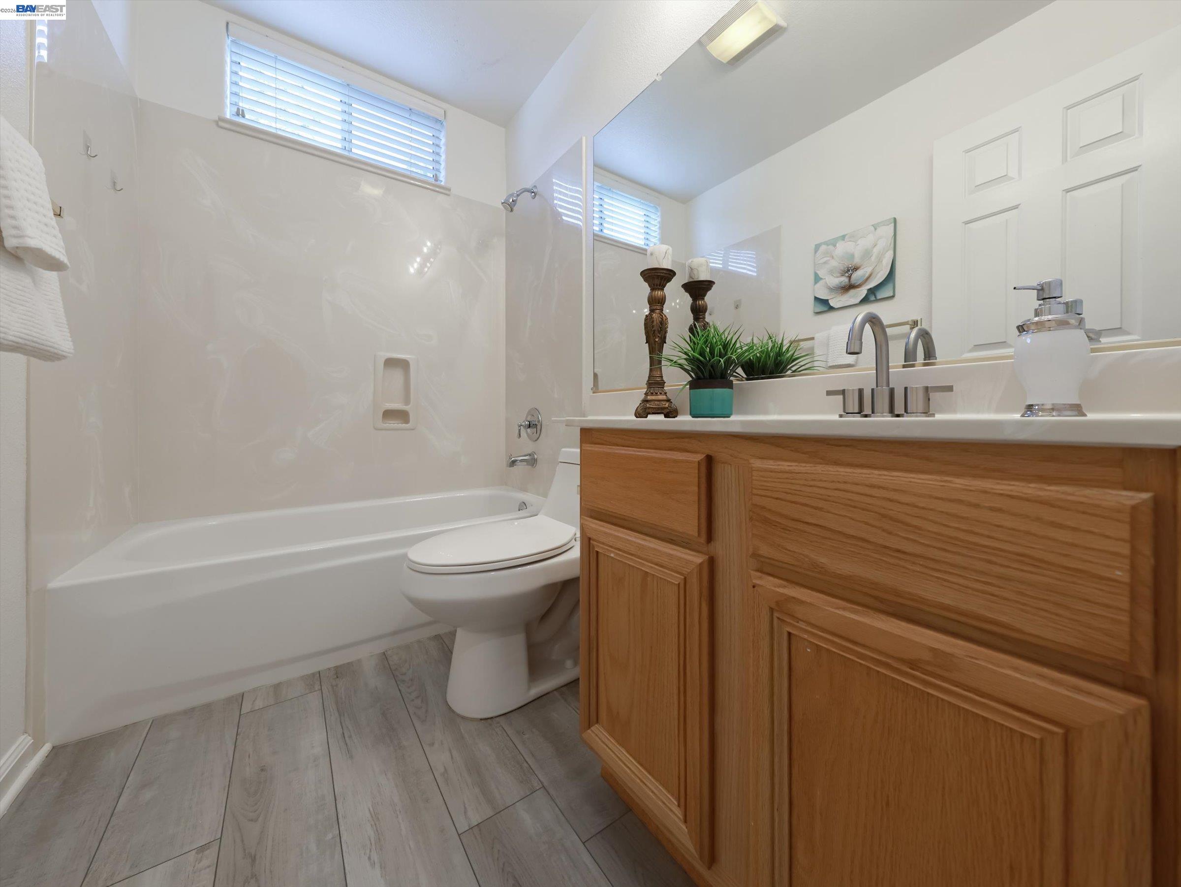 326 I Street Fremont, CA 94536 - Photo 29 of 40 a bathroom with a sink a toilet and shower