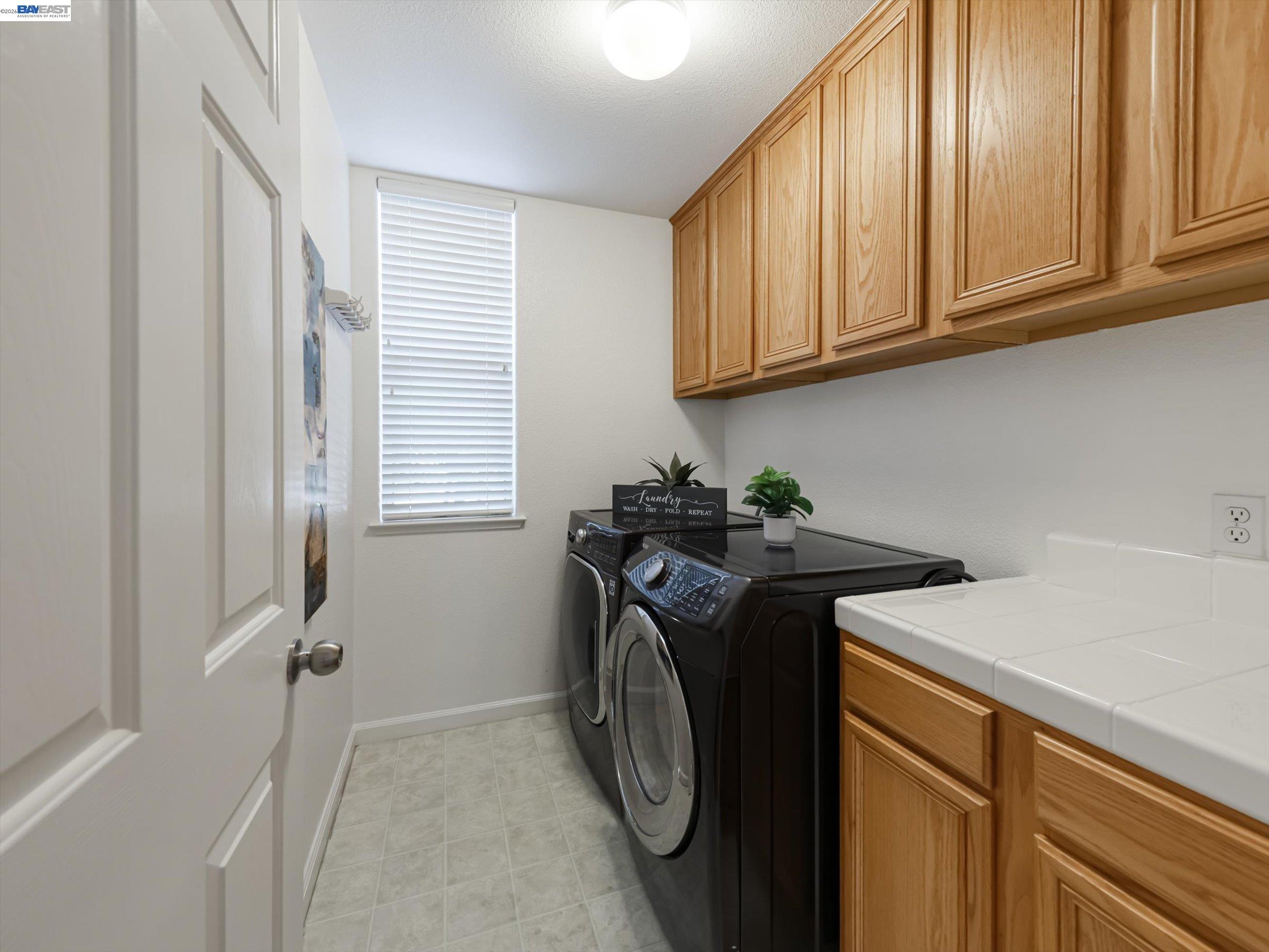 326 I Street Fremont, CA 94536 - Photo 30 of 40 a utility room with sink dryer and washer