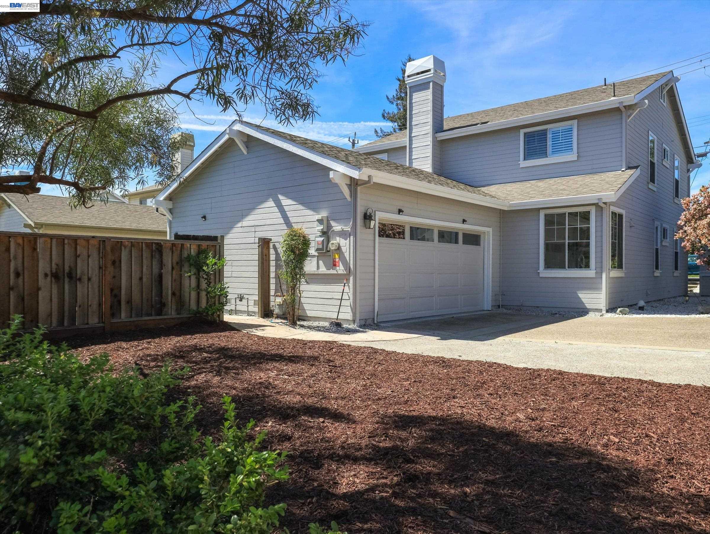 326 I Street Fremont, CA 94536 - Photo 3 of 40 a front view of a house with a yard and garage