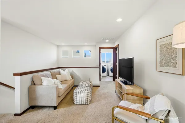 a bed room with a bed and a ceiling fan