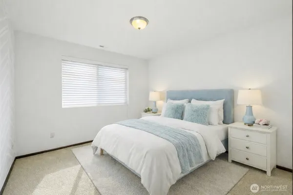 a bedroom with furniture and window