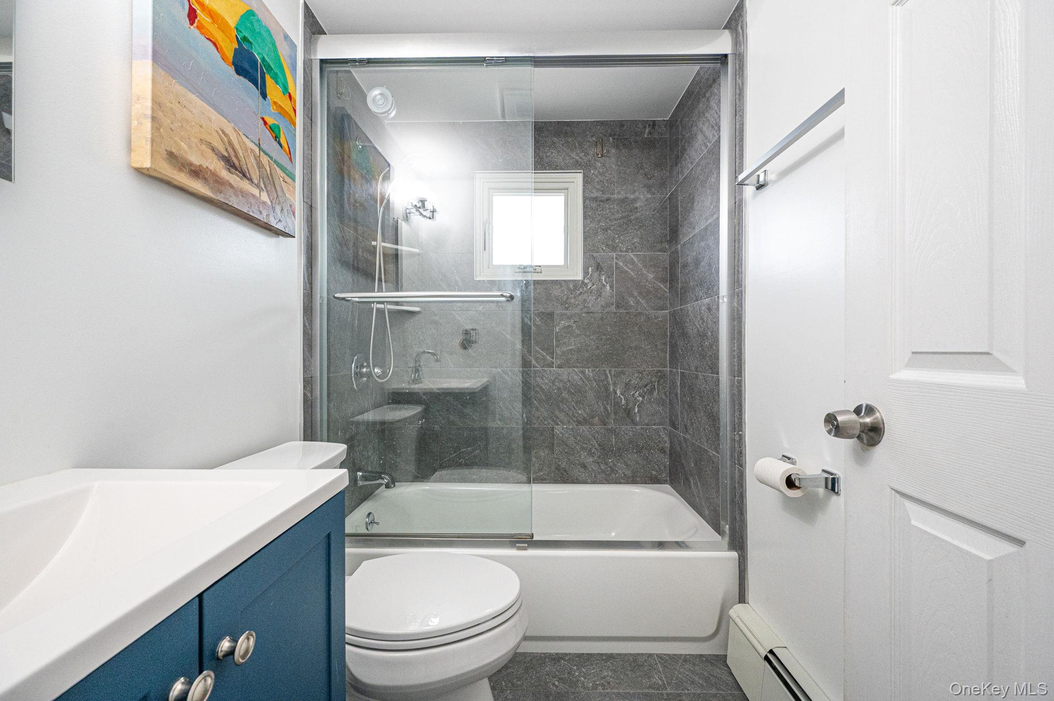 6 Rugby Drive West Shirley, NY 11967 - Photo 29 of 35 Fully Remodel - 2024Tub with glass doorAnderson window