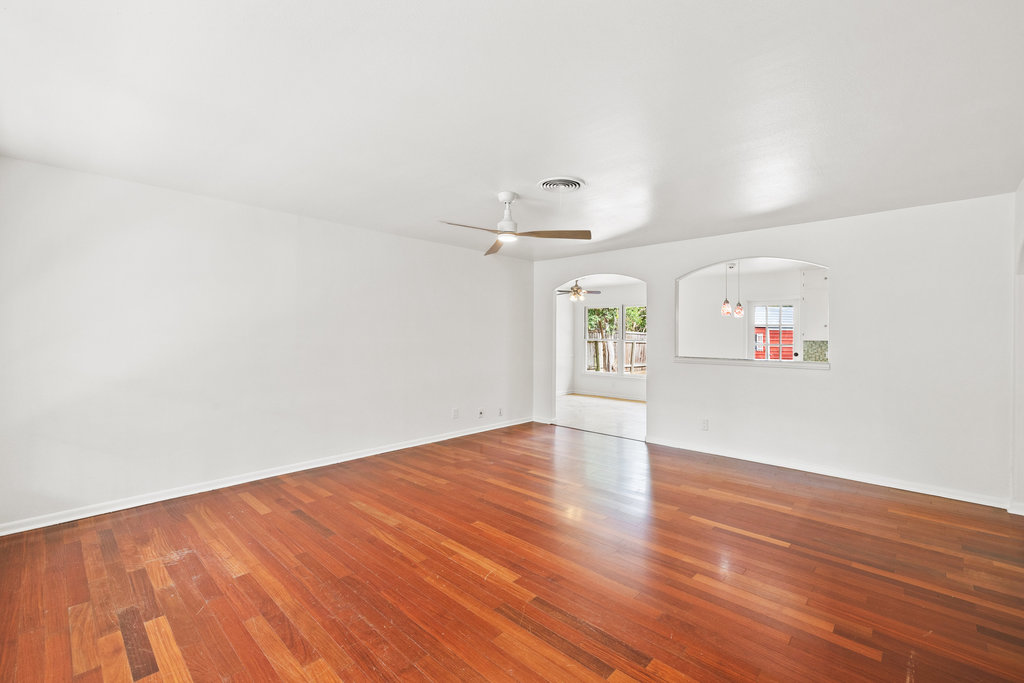 1502 Ridgehaven Drive Austin, TX 78723 - Photo 26 of 34 an empty room with wooden floor and windows