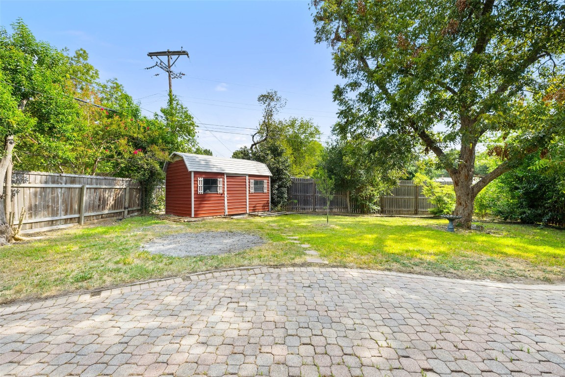 1502 Ridgehaven Drive Austin, TX 78723 - Photo 30 of 34 a view of a house with backyard and a tree