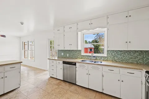 a kitchen with a sink and cabinets