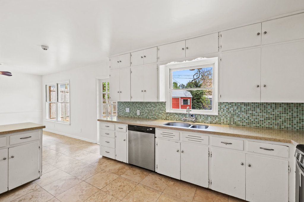 1502 Ridgehaven Drive Austin, TX 78723 - Photo 32 of 34 a kitchen with a sink and cabinets