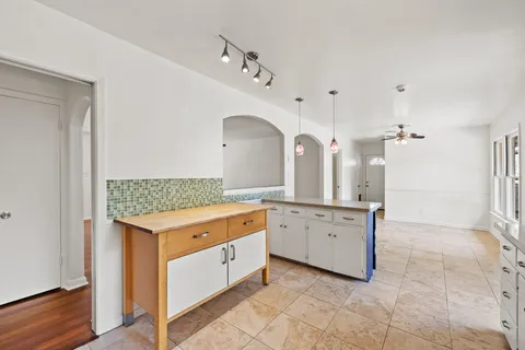 a kitchen with a stove and cabinets