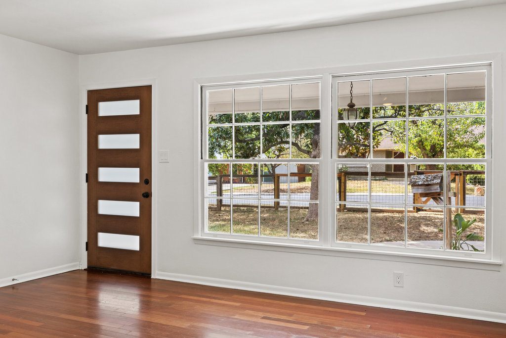 1502 Ridgehaven Drive Austin, TX 78723 - Photo 4 of 34 a view of a large window with wooden floor