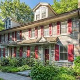 front view of brick building with a large windows