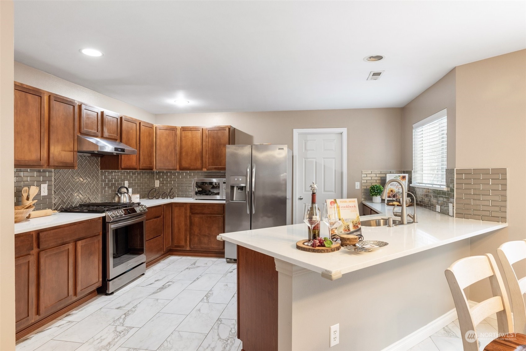 3500 154th Place Southeast Bothell, WA 98012 - Photo 11 of 36 a kitchen with kitchen island granite countertop a sink stove and cabinets