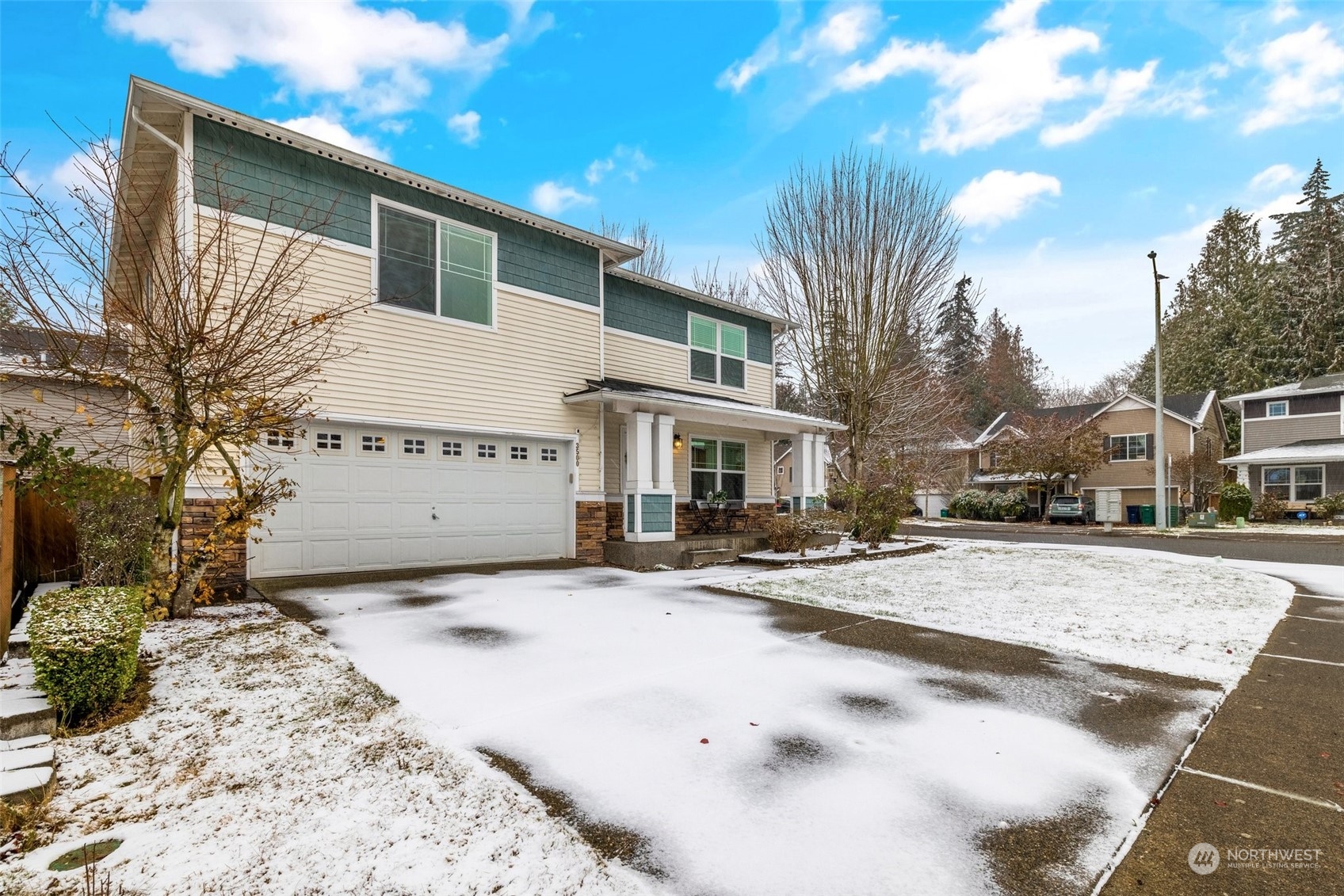 3500 154th Place Southeast Bothell, WA 98012 - Photo 3 of 36 a view of a white house with a snow on the road